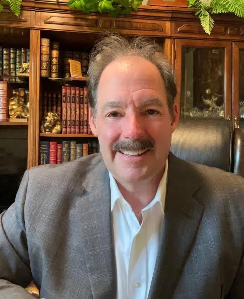 Portrait of attorney Roger Gilbert in his office